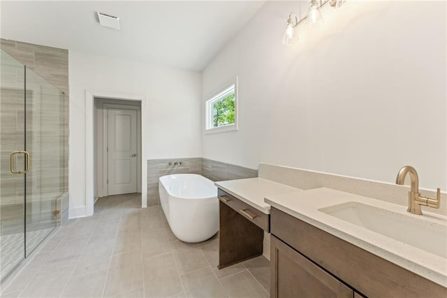 1005 Liberty Springs Dr, Woodstock, GA 30188 - bathroom featuring a freestanding bath, vanity, a stall shower, and tile patterned floors