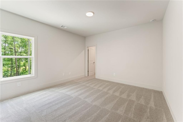 1005 Liberty Springs Dr, Woodstock, GA 30188 - spare room with light carpet and a smoke detector