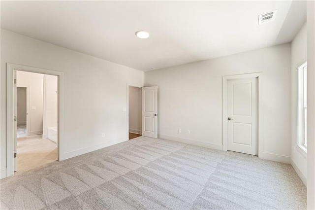 1005 Liberty Springs Dr, Woodstock, GA 30188 - unfurnished bedroom featuring light colored carpet