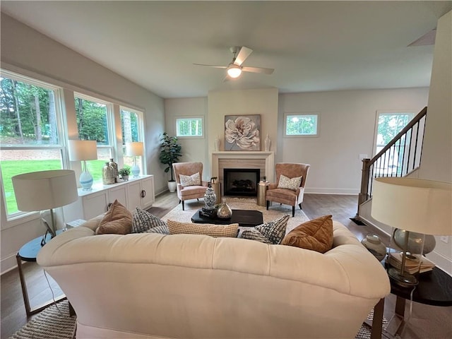 1005 Liberty Springs Dr, Woodstock, GA 30188 - living room featuring wood finished floors, a fireplace, and a ceiling fan