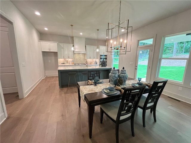 1005 Liberty Springs Dr, Woodstock, GA 30188 - dining area featuring light wood-style floors, recessed lighting, and a chandelier