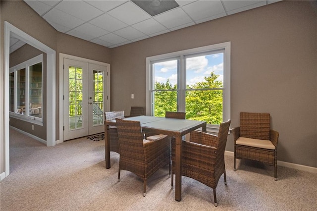 711 Wildcat Dr, Big Canoe, GA 30143 - dining space featuring light colored carpet, french doors, baseboards, and a paneled ceiling