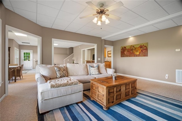 711 Wildcat Dr, Big Canoe, GA 30143 - carpeted living room featuring a ceiling fan, baseboards, and a drop ceiling