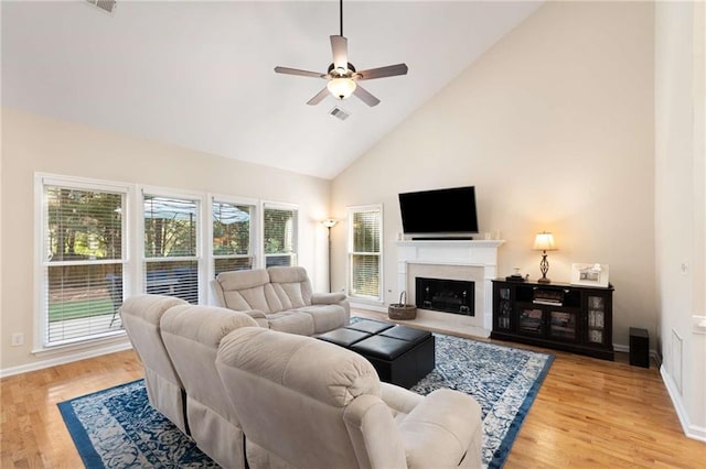 2740 Greymont Ct, Cumming, GA 30041 - living area featuring a ceiling fan, high vaulted ceiling, light wood-style flooring, and a fireplace