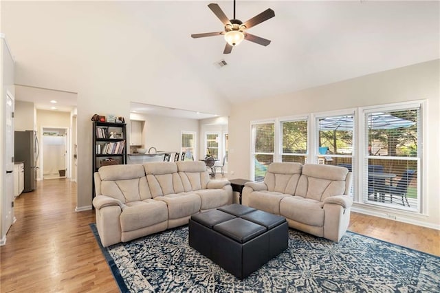 2740 Greymont Ct, Cumming, GA 30041 - living area with ceiling fan, light wood-type flooring, high vaulted ceiling, healthy amount of natural light, and recessed lighting