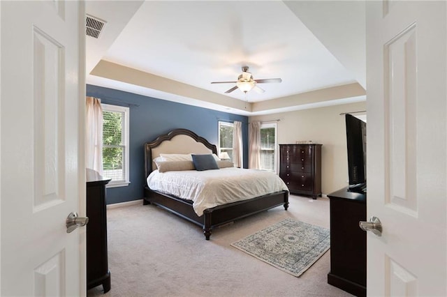 2740 Greymont Ct, Cumming, GA 30041 - carpeted bedroom featuring a tray ceiling and ceiling fan
