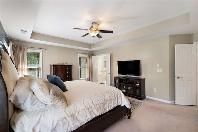 2740 Greymont Ct, Cumming, GA 30041 - bedroom featuring light colored carpet, a tray ceiling, and a ceiling fan