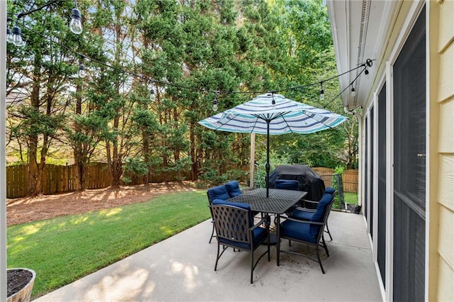 2740 Greymont Ct, Cumming, GA 30041 - fenced backyard with a patio area, outdoor dining space, and a grill