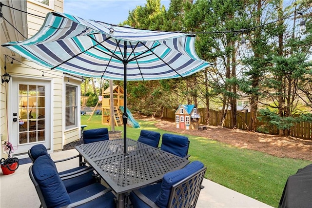 2740 Greymont Ct, Cumming, GA 30041 - fenced backyard with a playground, outdoor dining area, and a patio