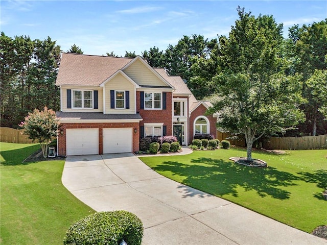 2740 Greymont Ct, Cumming, GA 30041 - view of front of house with driveway, a garage, and brick siding