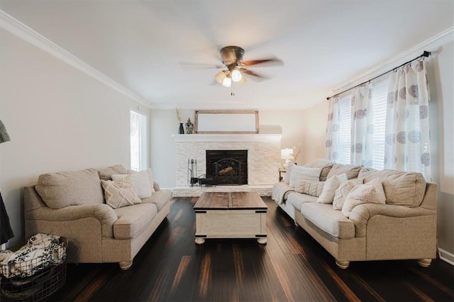511 Laird Rd, Hiram, GA 30141 - living area with dark wood-style flooring, a ceiling fan, crown molding, plenty of natural light, and a fireplace