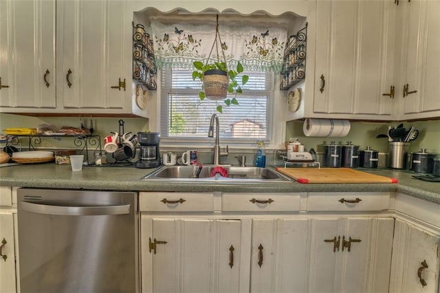 kitchen featuring a sink, white cabinets, and dishwasher