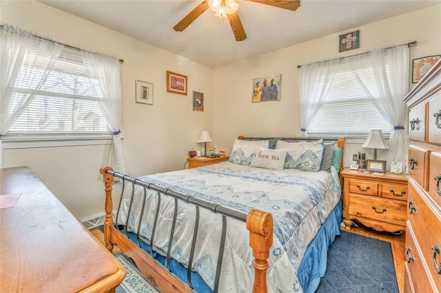 bedroom with ceiling fan and wood finished floors