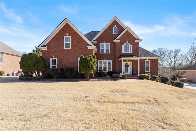 view of property featuring a front lawn