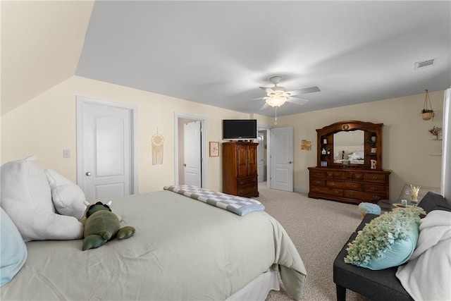 bedroom with lofted ceiling, carpet flooring, and ceiling fan