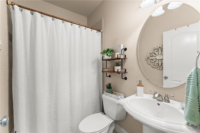 bathroom with sink and toilet