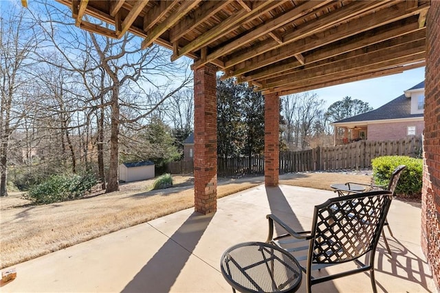 view of patio / terrace featuring a shed