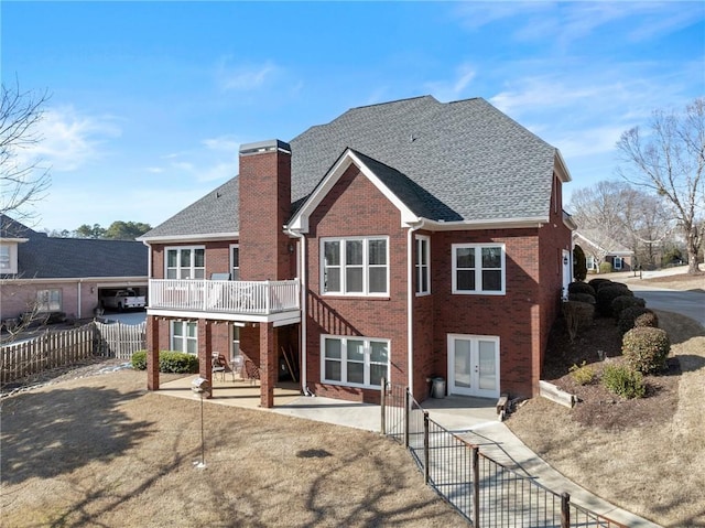 rear view of property with french doors and a patio