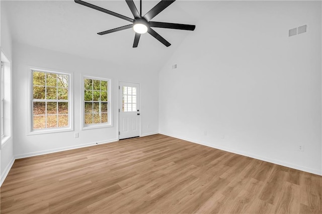 unfurnished room with high vaulted ceiling, ceiling fan, and light hardwood / wood-style flooring