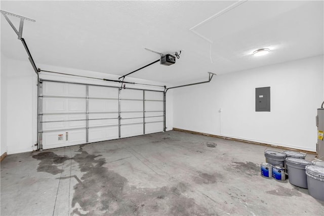 garage featuring a garage door opener and electric panel