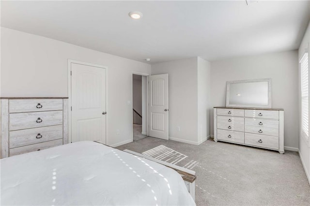 bedroom with light colored carpet