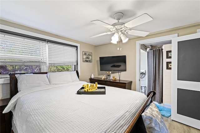 bedroom featuring a ceiling fan and light wood-style flooring