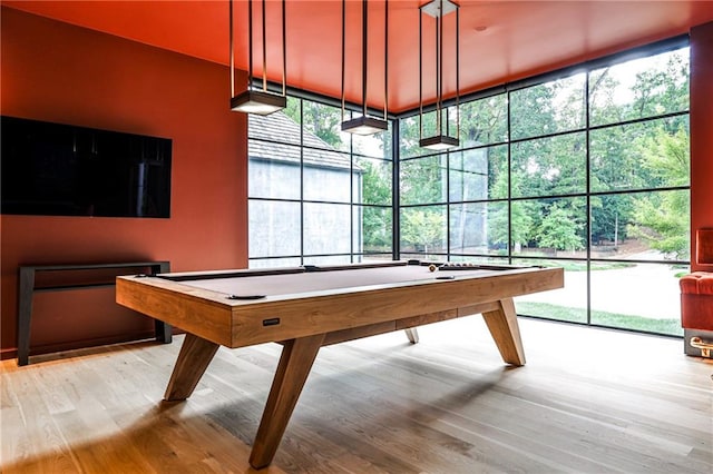 rec room with plenty of natural light, light hardwood / wood-style floors, and billiards