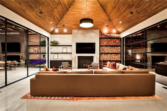 unfurnished living room with a large fireplace, high vaulted ceiling, wood ceiling, and concrete floors