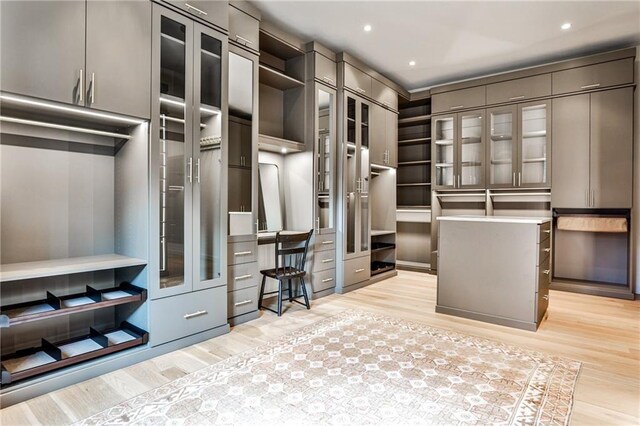 bedroom featuring access to exterior and light wood-type flooring