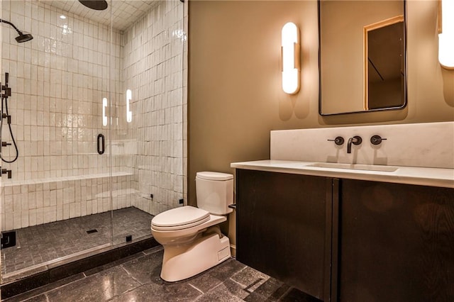 bathroom with vanity, toilet, and walk in shower