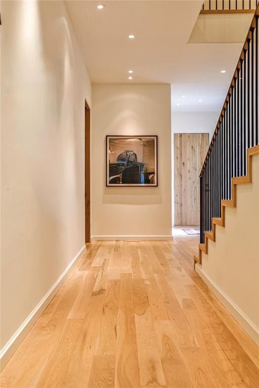 hall with light hardwood / wood-style floors