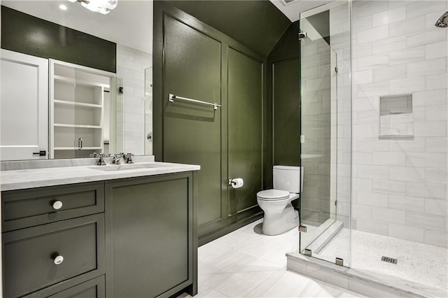 bathroom featuring tile patterned flooring, vanity, toilet, and an enclosed shower