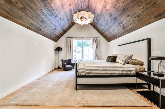 bedroom with wooden ceiling, light hardwood / wood-style floors, vaulted ceiling, and an inviting chandelier