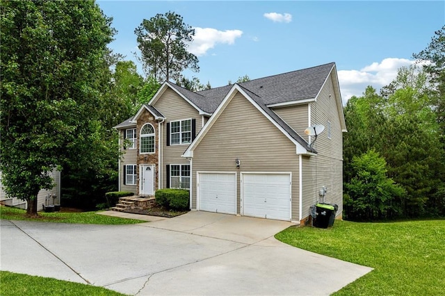 view of front of property featuring a garage, concrete driveway, and a front yard