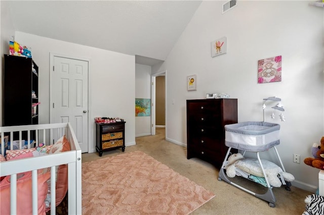 bedroom featuring lofted ceiling, light carpet, visible vents, and baseboards