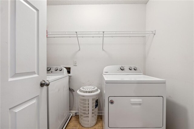 washroom featuring washer and dryer and laundry area