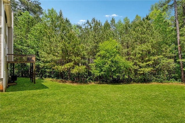 view of yard with a wooden deck