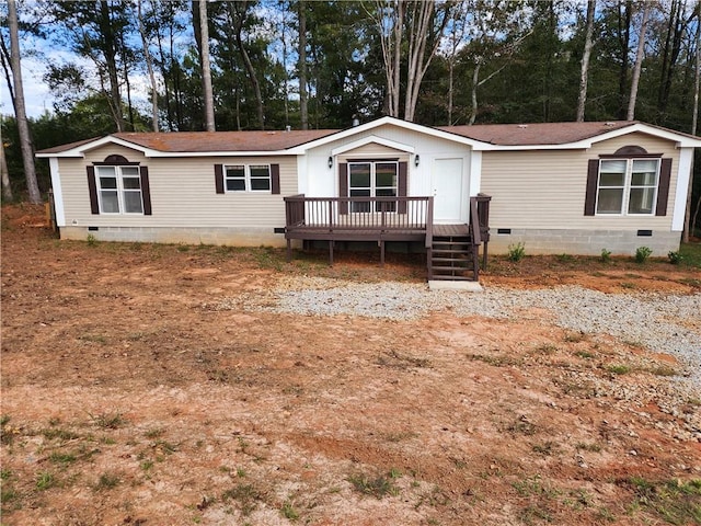 manufactured / mobile home featuring a wooden deck