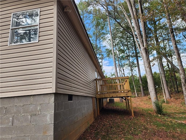 view of side of property featuring a deck