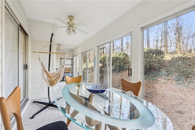 sunroom / solarium featuring ceiling fan