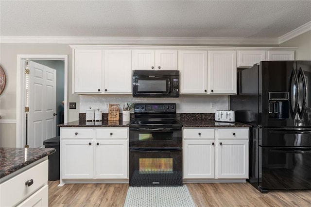 kitchen with black appliances, white cabinets, decorative backsplash, and crown molding