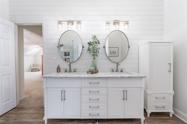 bathroom with vanity and wood-type flooring