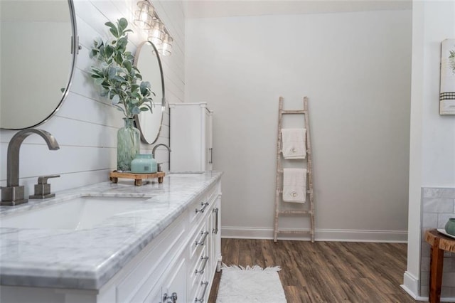 bathroom with hardwood / wood-style flooring and vanity