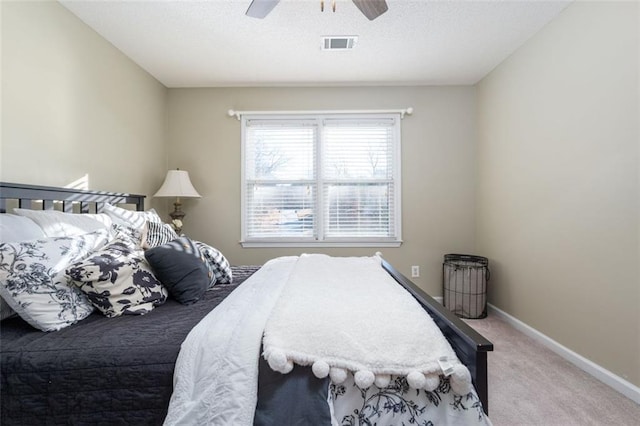 bedroom with ceiling fan and carpet floors