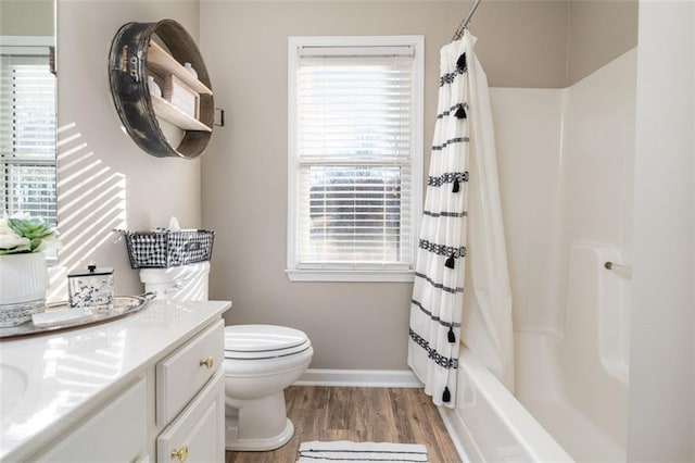 full bathroom with toilet, vanity, shower / tub combo with curtain, and hardwood / wood-style floors