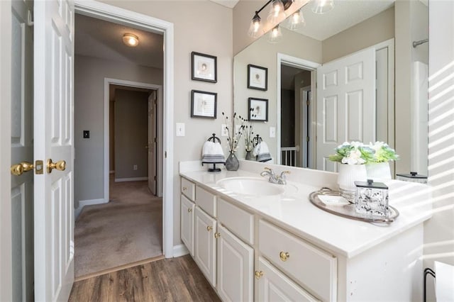 bathroom with vanity and hardwood / wood-style floors