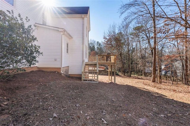 view of side of home featuring a deck