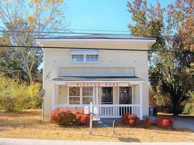 2771 Mann Rd, Winston, GA 30187 - view of front of house featuring covered porch and stucco siding