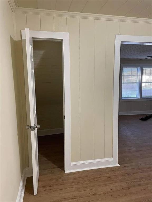 2771 Mann Rd, Winston, GA 30187 - corridor featuring wood finished floors, a decorative wall, and ornamental molding