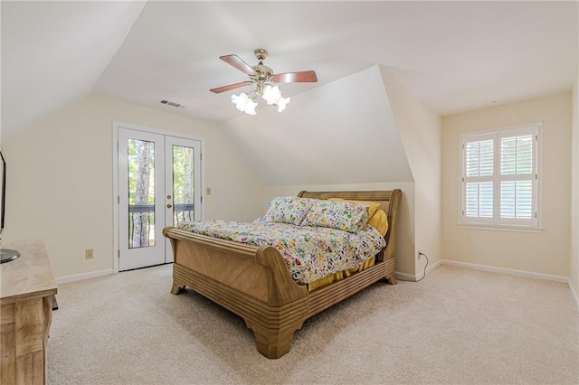 bedroom with access to outside, light carpet, lofted ceiling, and visible vents